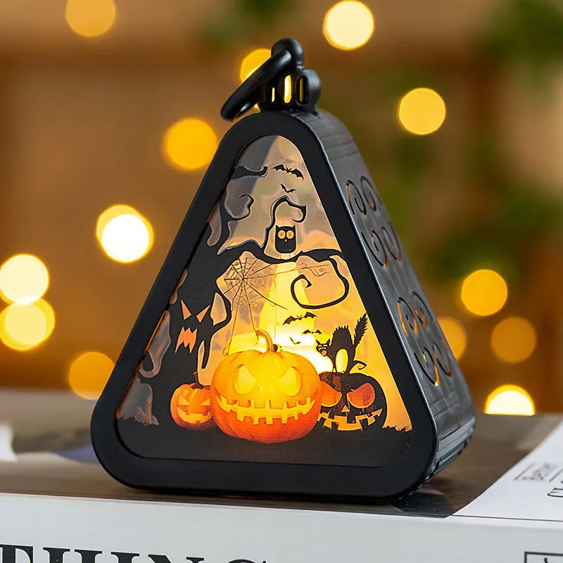 A Halloween decoration pumpkin lamp prop in plastic and glass, showing one of the four colour design options.