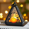 A Halloween decoration pumpkin lamp prop in plastic and glass, showing one of the four colour design options.
