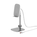 Baseus 15W wireless charger stand in silver holding a smartphone on a desk