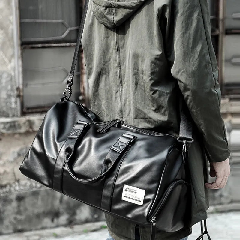 Large black waterproof PU leather sports training bag with multiple pockets and a breathable back panel.