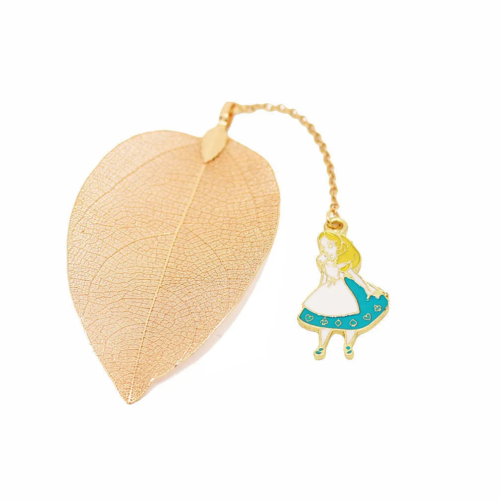 Set of three metal bookmarks featuring Alice, a rabbit, and a clock charm on a leaf base.