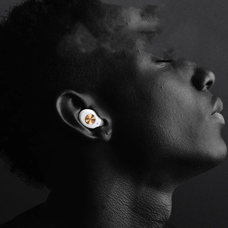 Pebble Series mini wireless Bluetooth earbuds and charging case in black, placed on a white surface.