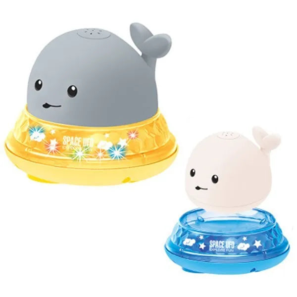Grey and white whale bath toy with water spray, LED lights, floating in water