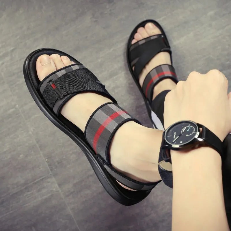 Pair of youth sports sandals with a blue Lycra upper and light polyurethane sole.