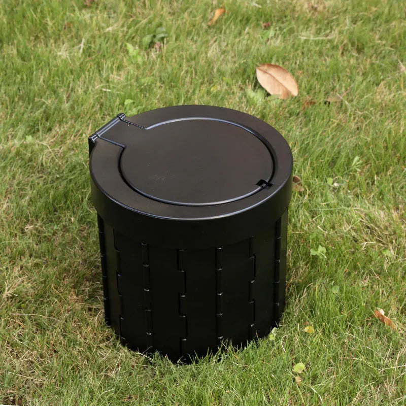 Portable car folding toilet in grey, oval shape, folded for storage