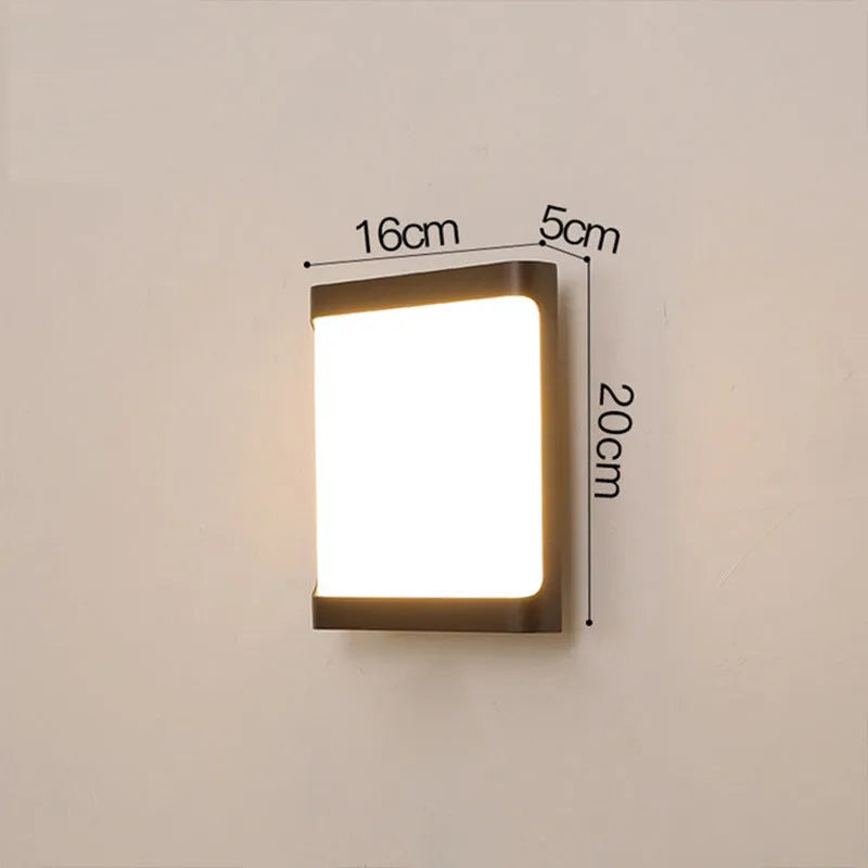 Square outdoor LED wall light with aluminium housing, shown mounted on a wall.