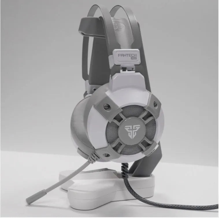 Black FANTECH HG11 USB gaming headset with over-ear cups and RGB lighting on a stand.
