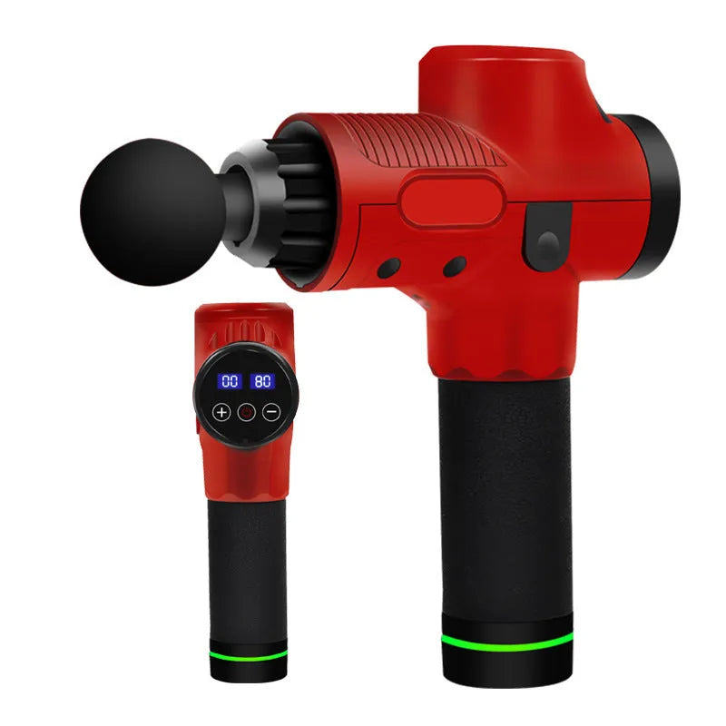 Black electric muscle massage gun with 7 different attachment heads on a table.