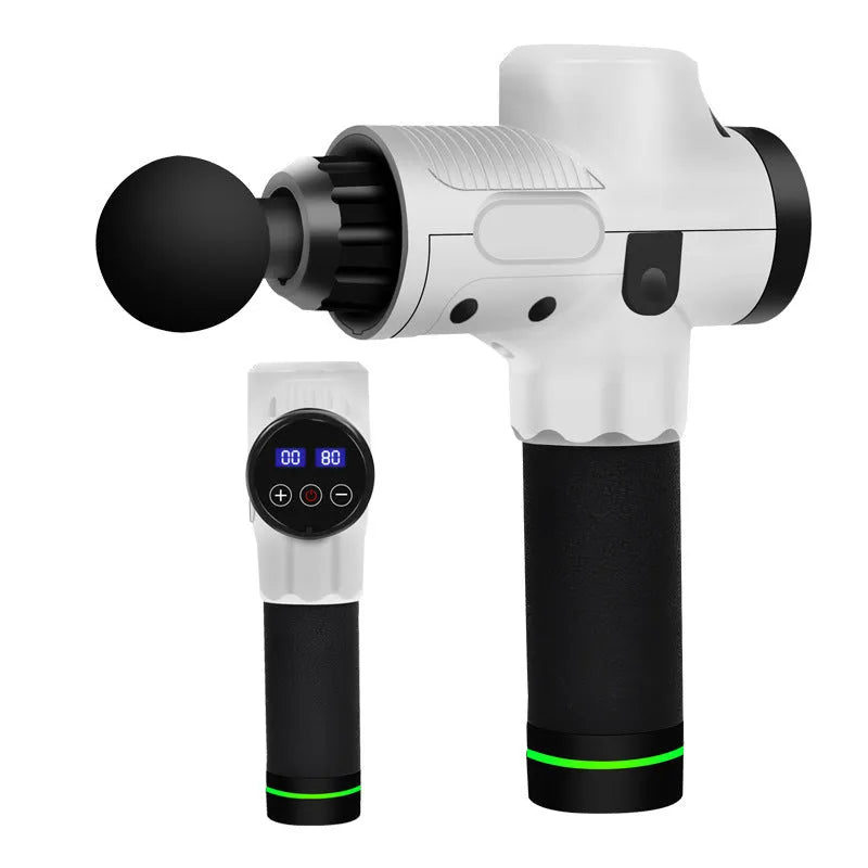 Black electric muscle massage gun with 7 different attachment heads on a table.