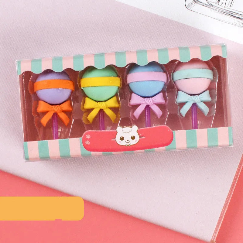 Assortment of 12 colourful cartoon erasers shaped like ice cream, lollipops, doughnuts, and cones for children.