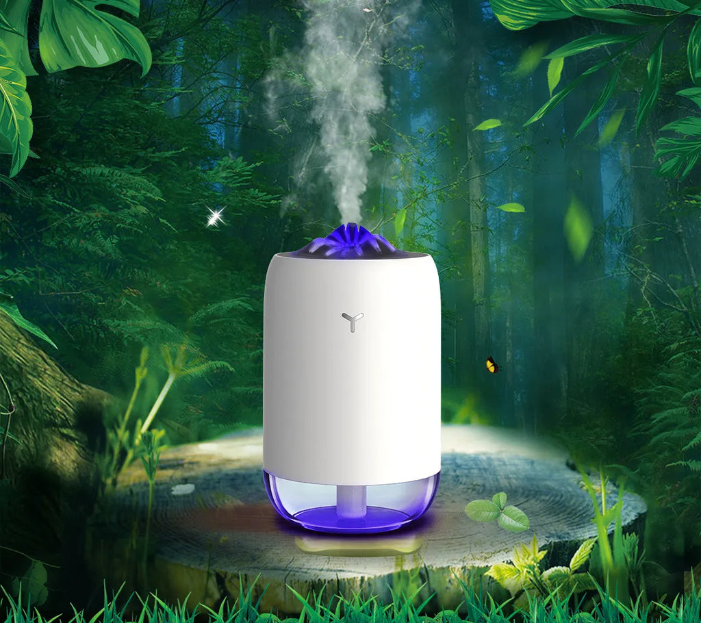 Magic Flame ultrasonic mini humidifier in white, blue, and pink colours on a desktop