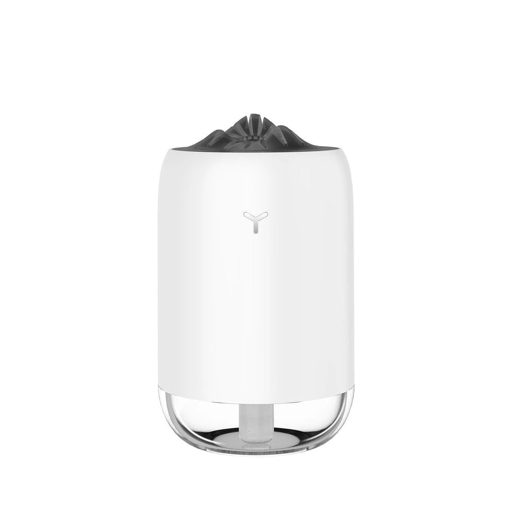 Magic Flame ultrasonic mini humidifier in white, blue, and pink colours on a desktop