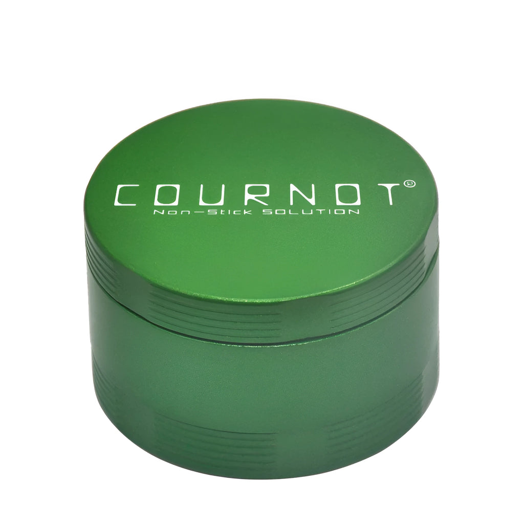Black four-layer metal smoke grinder with diamond teeth on a grey background