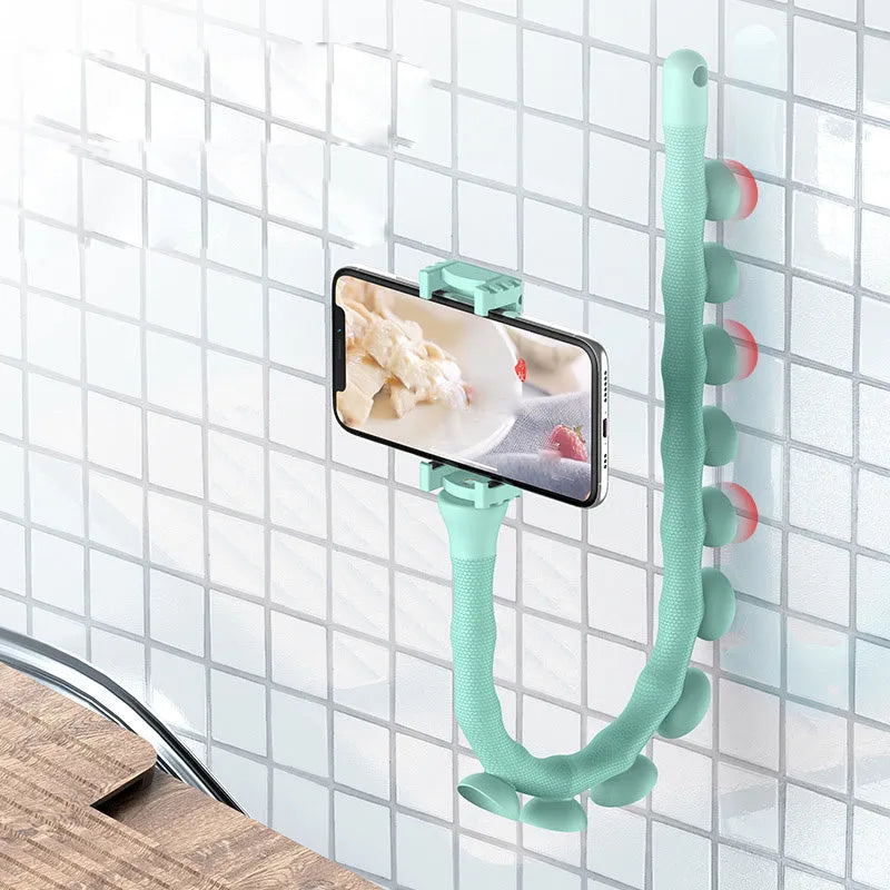 Flexible worm-style lazy bracket mobile phone holder with long silicone arm and black rubber suction cup base.