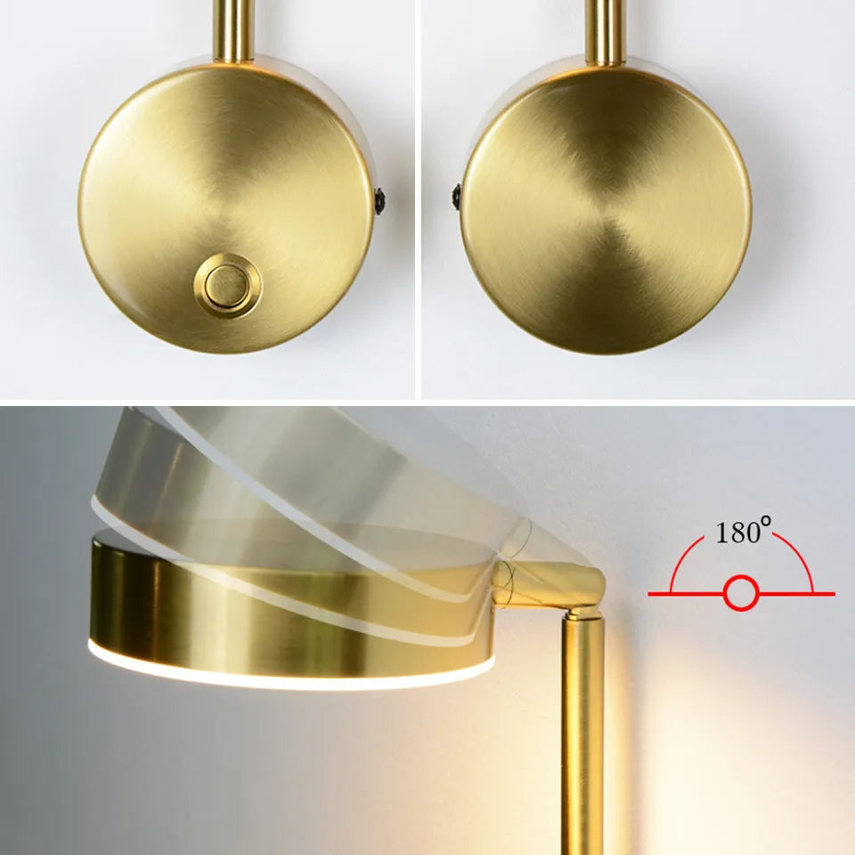 Gold LED wall lamp with rotary switch and acrylic shade on a wall