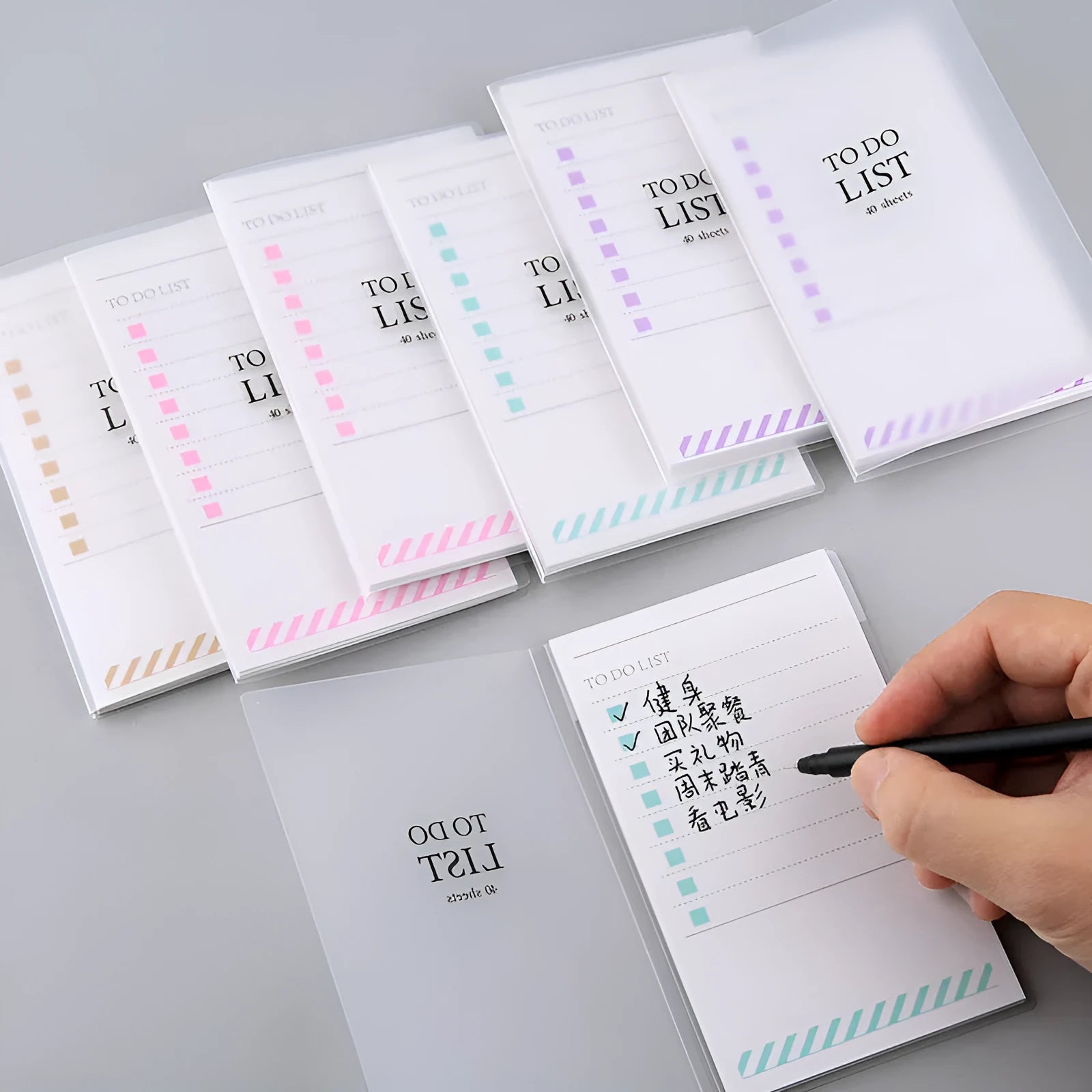 Yellow, green, and purple A6 tearable notebooks with frosted PP covers, showing size of 13 by 8 cm