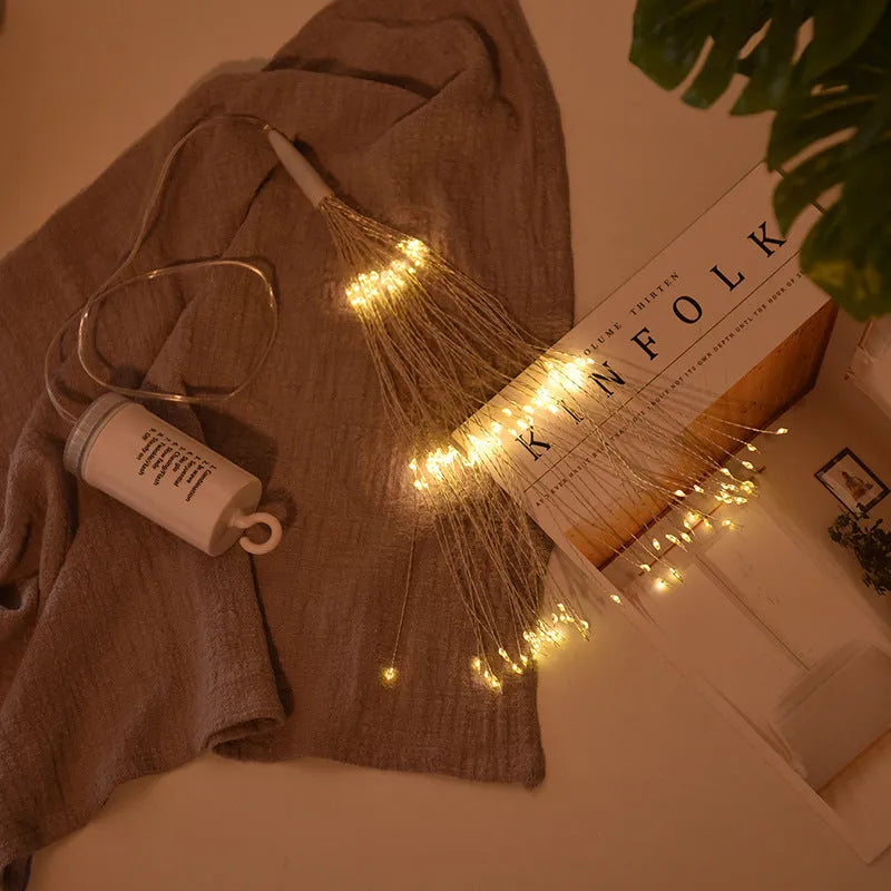 Solar-powered LED meteor shower string lights creating starry explosion effect in warm white colour