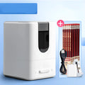 Chenguang electric pencil sharpener in white with spare knife holder, power cord and two Toshiba batteries on a desk