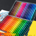 Double-ended watercolour pen set with soft brush head and fine point tip alongside drawing book