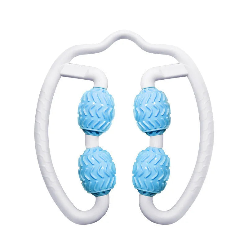 Purple and pink silicone annular leg massage roller on a plain background.