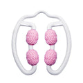 Purple and pink silicone annular leg massage roller on a plain background.