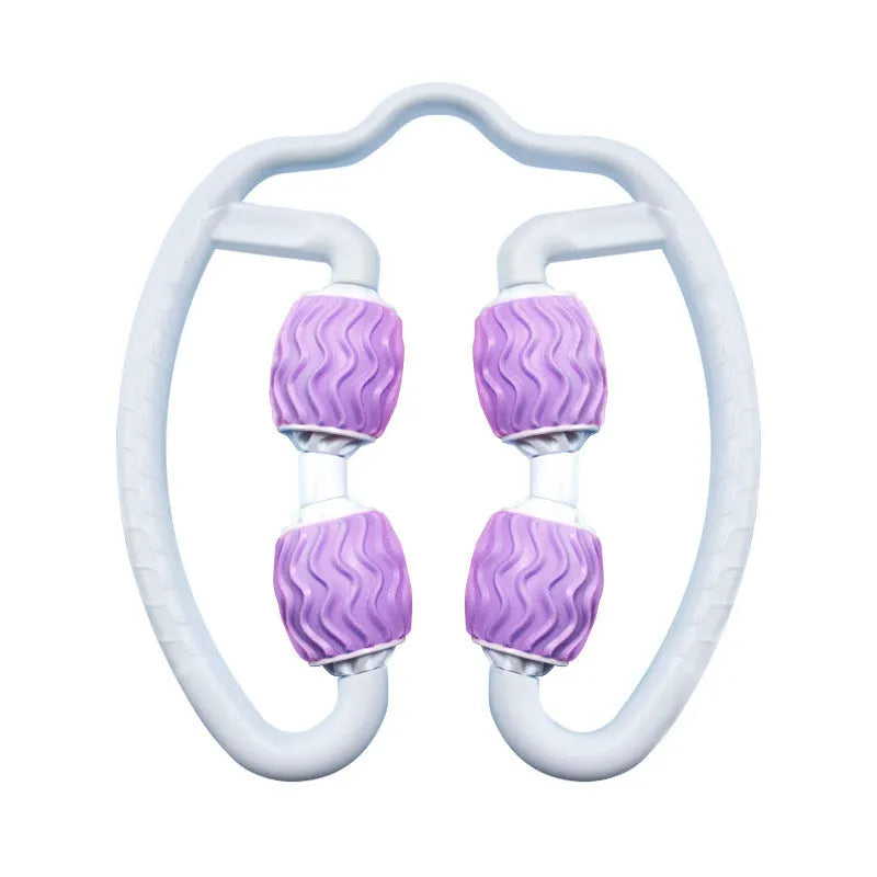 Purple and pink silicone annular leg massage roller on a plain background.