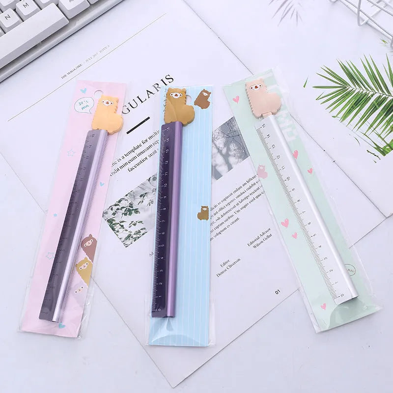 30 centimetre long silver aluminum ruler with black printed measurement scales.
