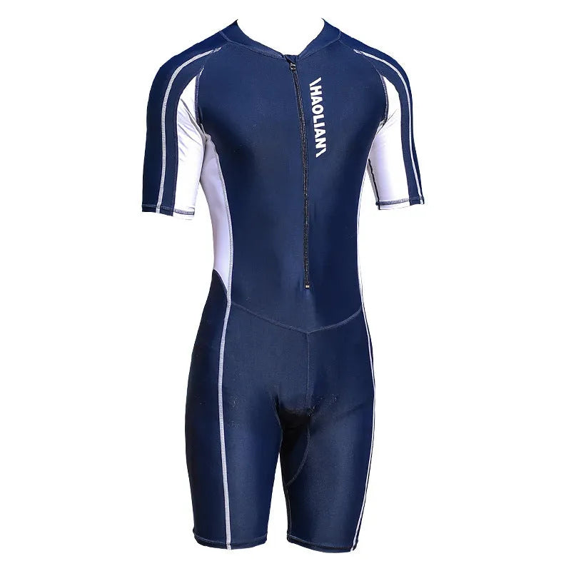 Men's short-sleeved neoprene surfing suit with front zip, in black, shown on a model.