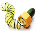 Yellow and green plastic spiral vegetable cutter on a kitchen counter.