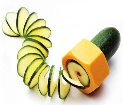 Yellow and green plastic spiral vegetable cutter on a kitchen counter.