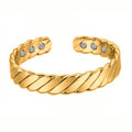 Silver tone metal bracelet on a flat surface, unisex design for men women children