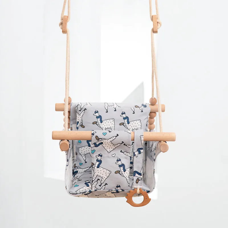 Cotton canvas baby swing chair with wooden seat and cushion hanging indoors