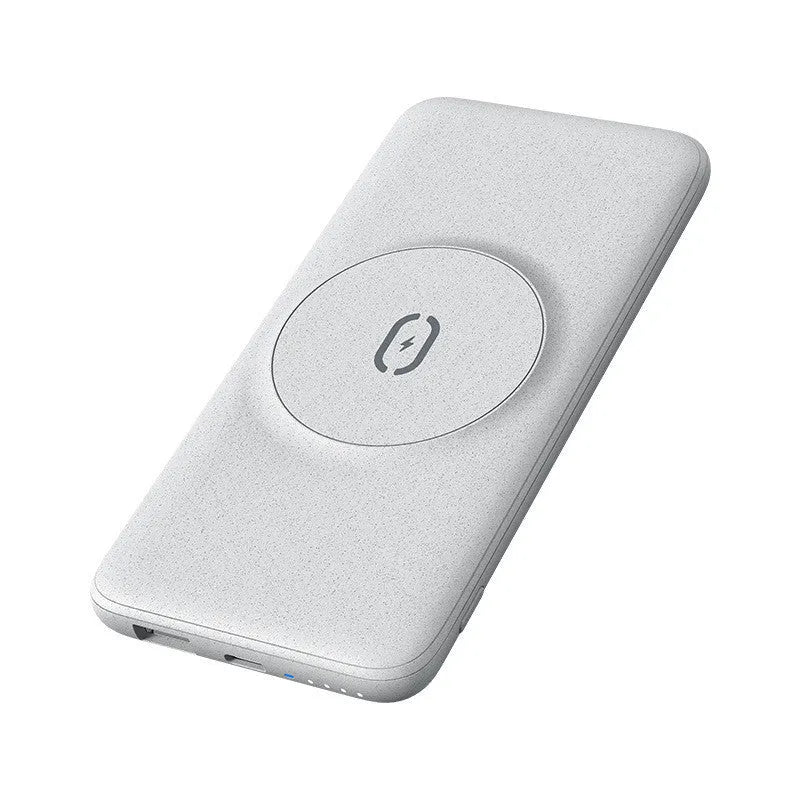 Mint green magnetic wireless power bank with back clip, shown next to a compatible iPhone.