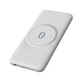 Mint green magnetic wireless power bank with back clip, shown next to a compatible iPhone.