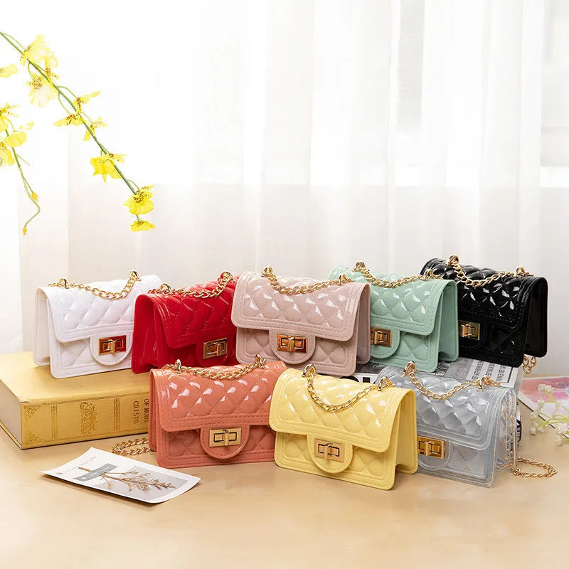 Mini pearl chain shoulder bag in PVC with lacquered check finish and lock opening, women's summer handbag