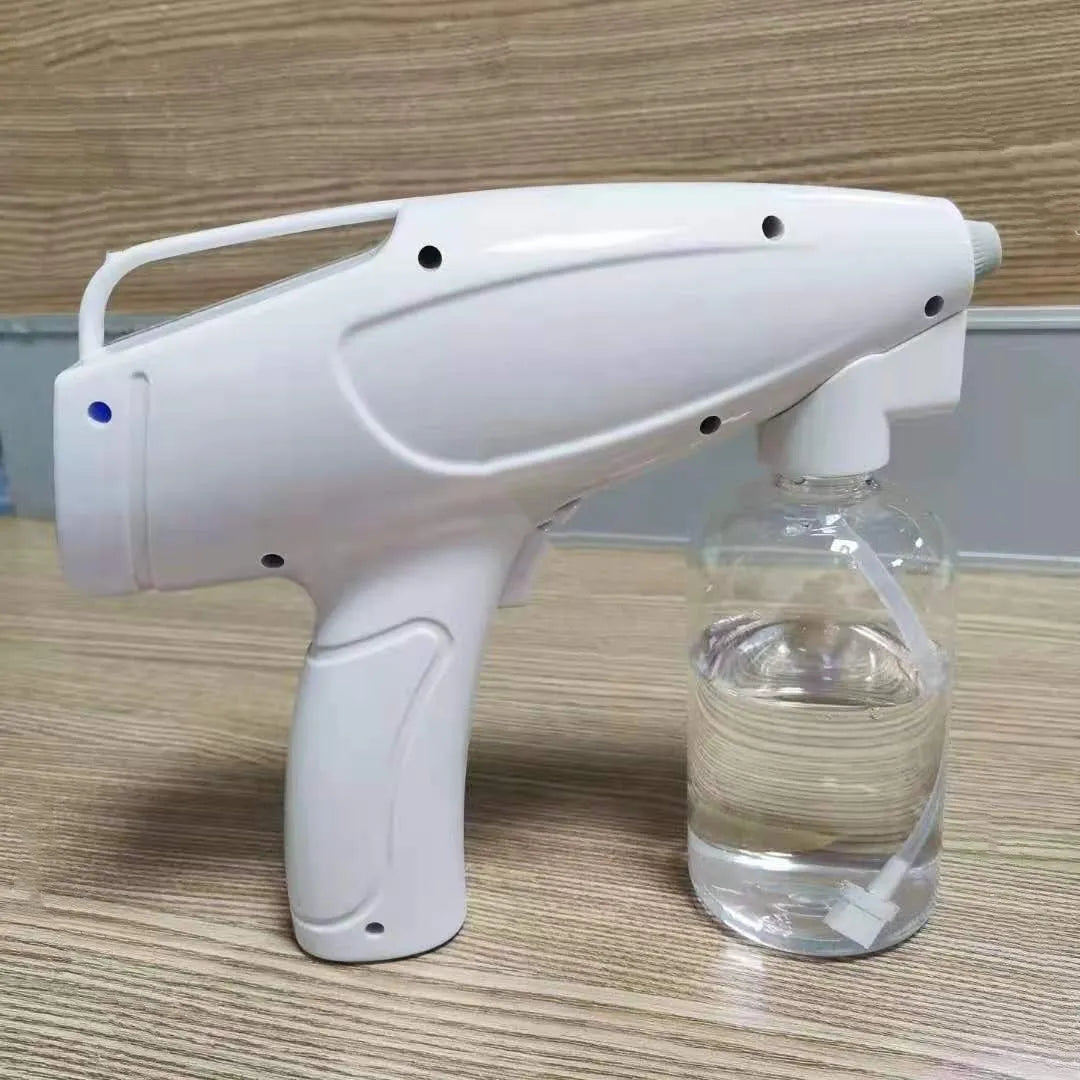 White handheld cordless electric spray gun with USB-C charging port on a plain background.