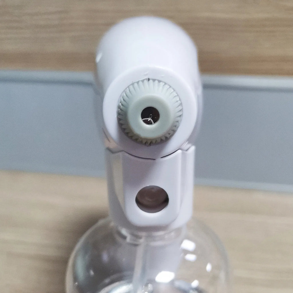 White handheld cordless electric spray gun with USB-C charging port on a plain background.