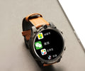 Black smart phone watch with 1.6-inch screen, showing a video call interface on its display.