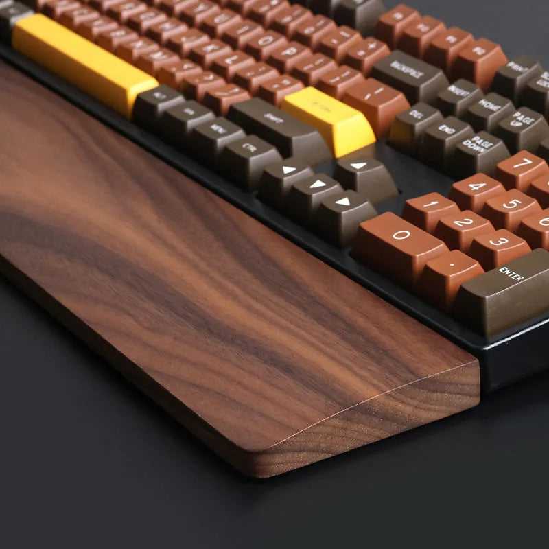 Walnut wood mechanical keyboard wrist rest showing natural wood grain