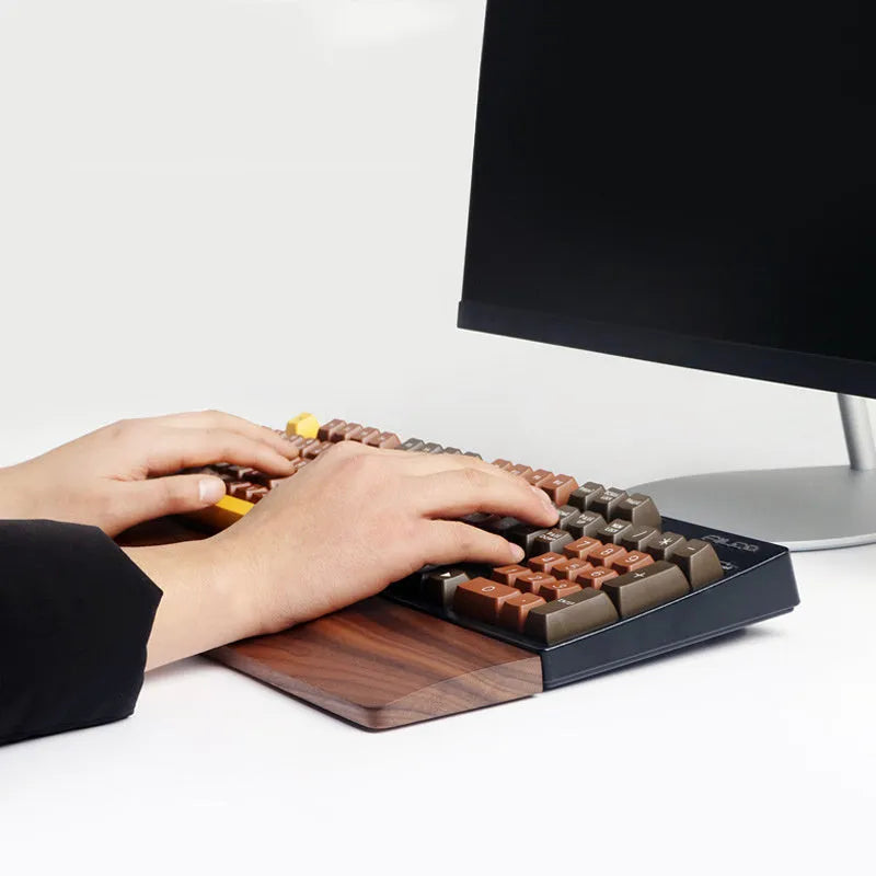 Walnut wood mechanical keyboard wrist rest showing natural wood grain