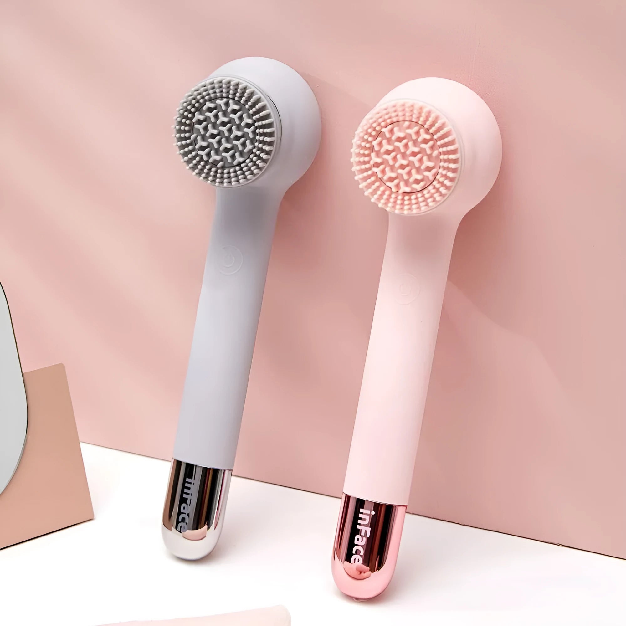 InFace CB-11D grey electric shower brush with four rotating brush heads on a bathroom shelf.