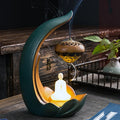 Handmade pottery Buddha statue ornament and ceramic backflow aroma diffuser with U-shaped power connection line