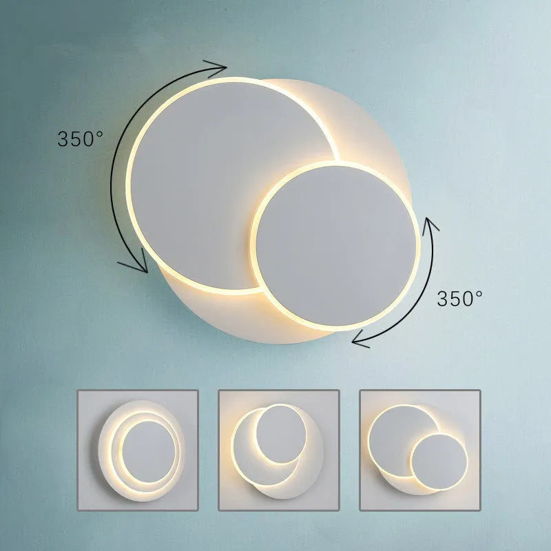 Modern round acrylic wall lamp in black or white, shown in large, medium, and small sizes.
