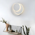 Modern round acrylic wall lamp in black or white, shown in large, medium, and small sizes.