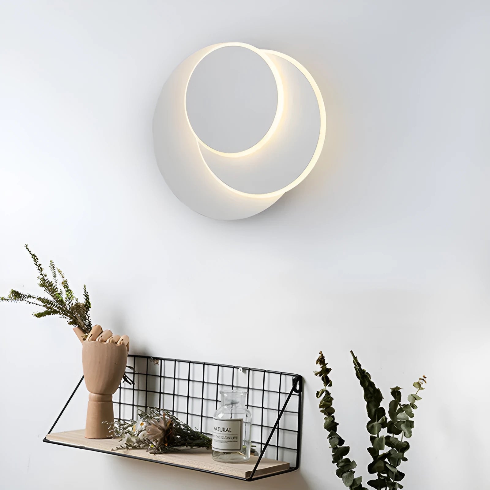 Modern round acrylic wall lamp in black or white, shown in large, medium, and small sizes.