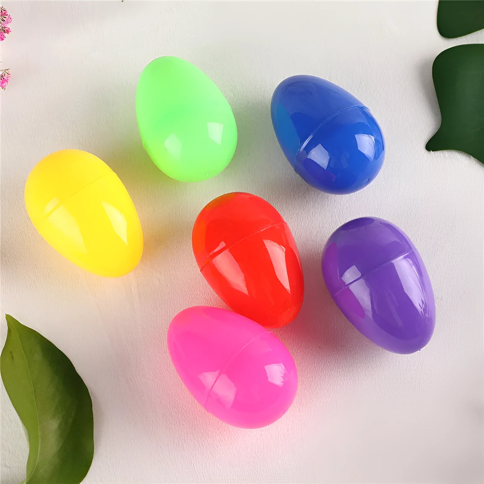 60 assorted colour fillable plastic Easter eggs 4x6cm each on a light background
