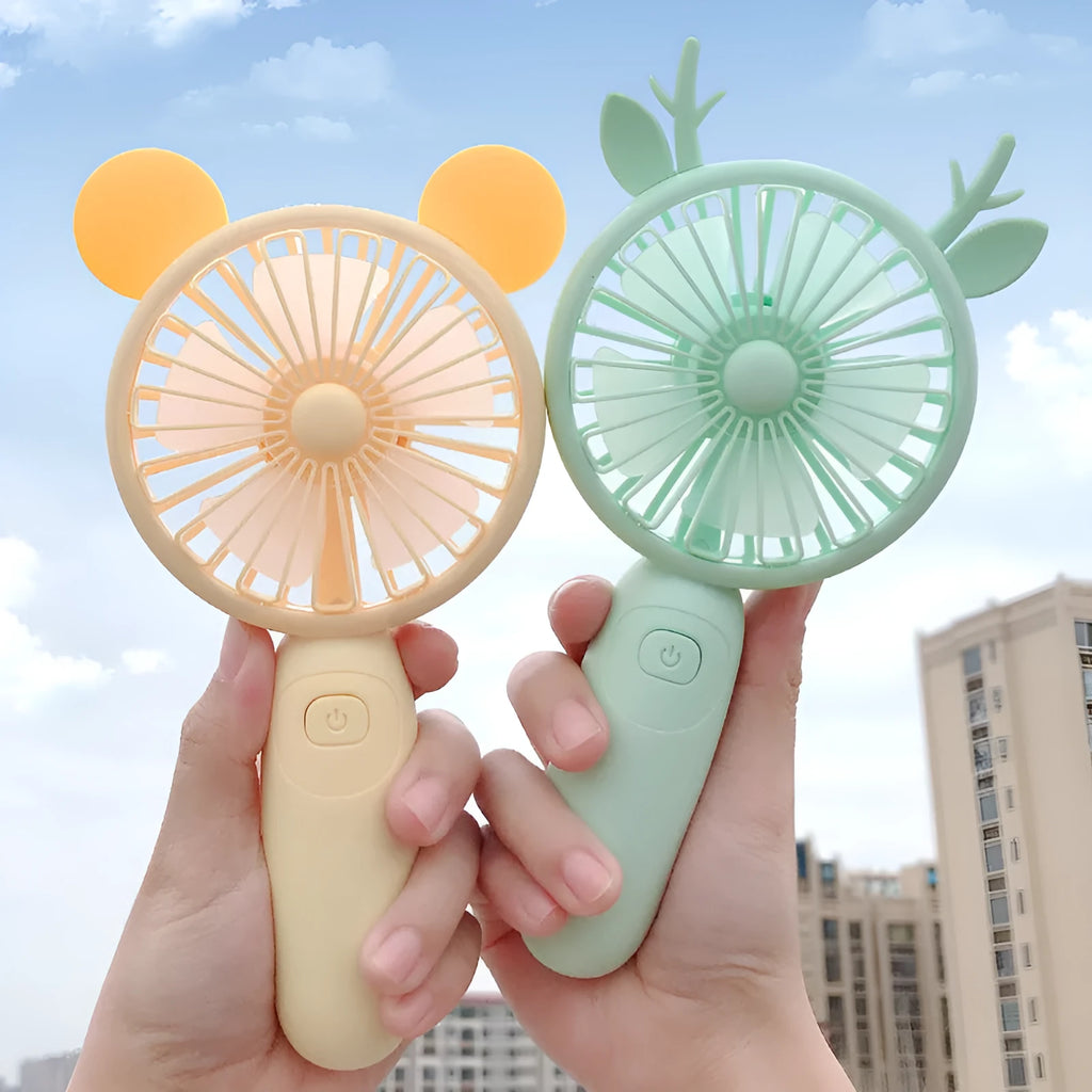 Cartoon-style hand-held USB rechargeable fan in blue, green, pink, or yellow colours