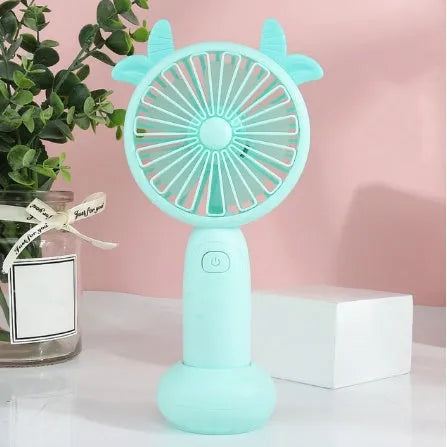 Cartoon-style hand-held USB rechargeable fan in blue, green, pink, or yellow colours