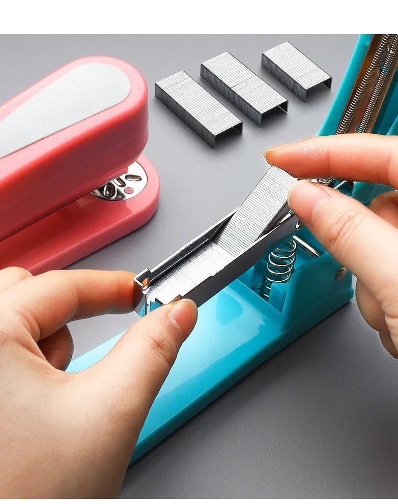 360-degree rotatable desktop stapler in various colours showing metal nail outlet and deep paper feed.