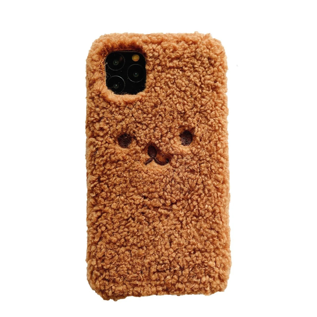 Brown plush cartoon bear face embroidered on a soft TPU iPhone case for iPhone 11.